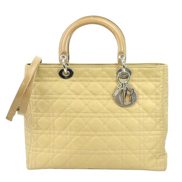 Premium Canvas Lady Handbag with Emblematic Details and Structured Silhouette