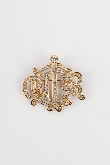 Broche dorée Dior