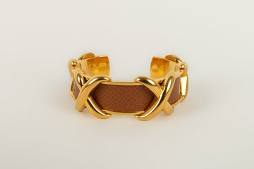 Bracelet en métal doré et cuir Hermès