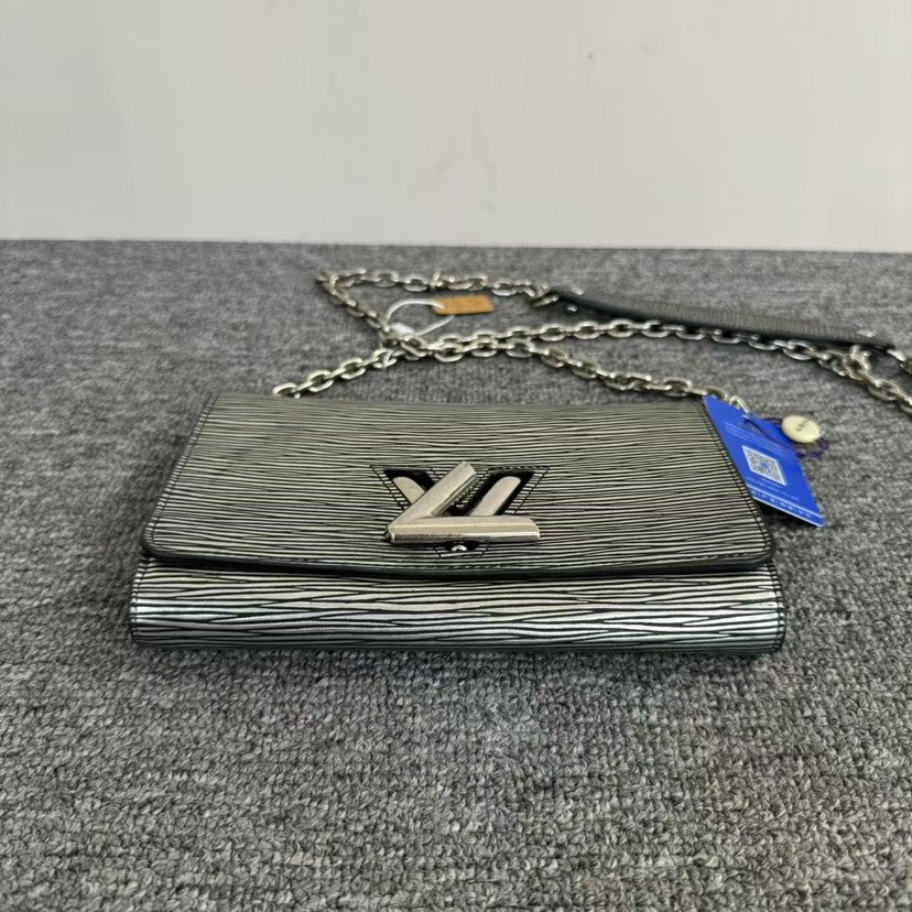 Louis Vuitton Twist WOC Silver Clutch